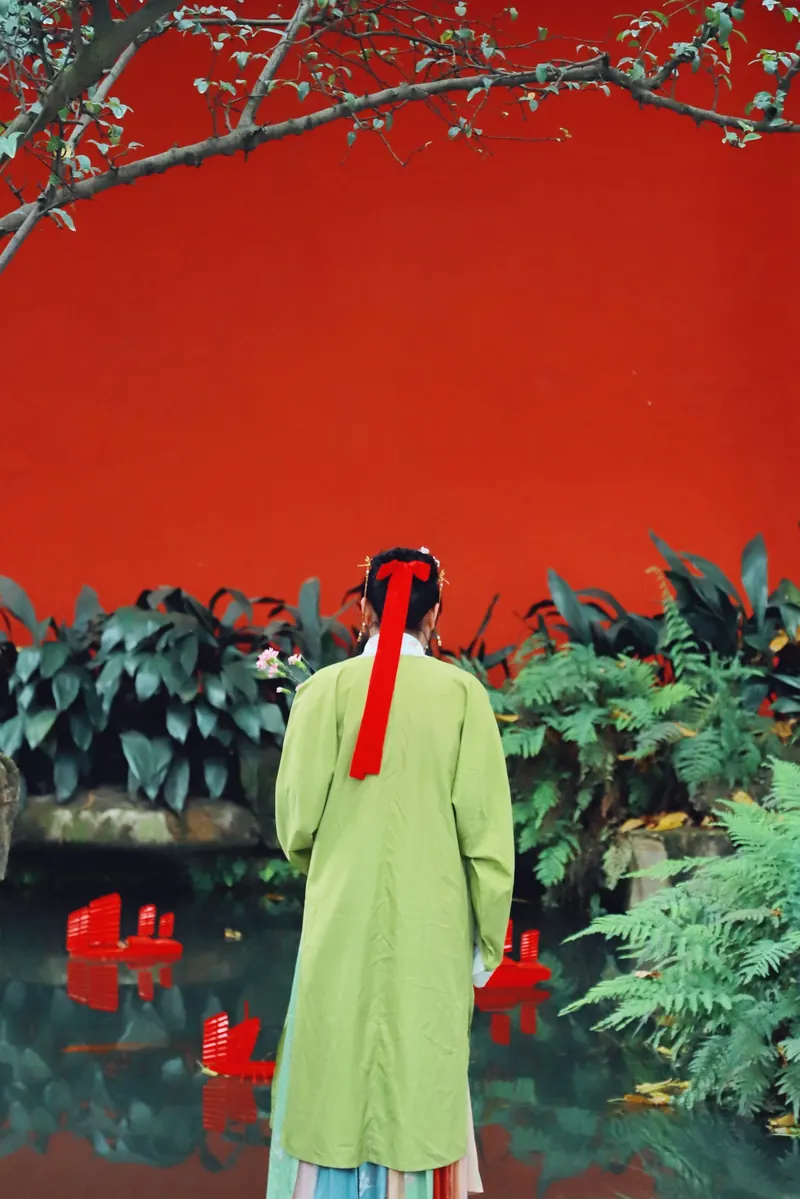 Hanfu by a red wall